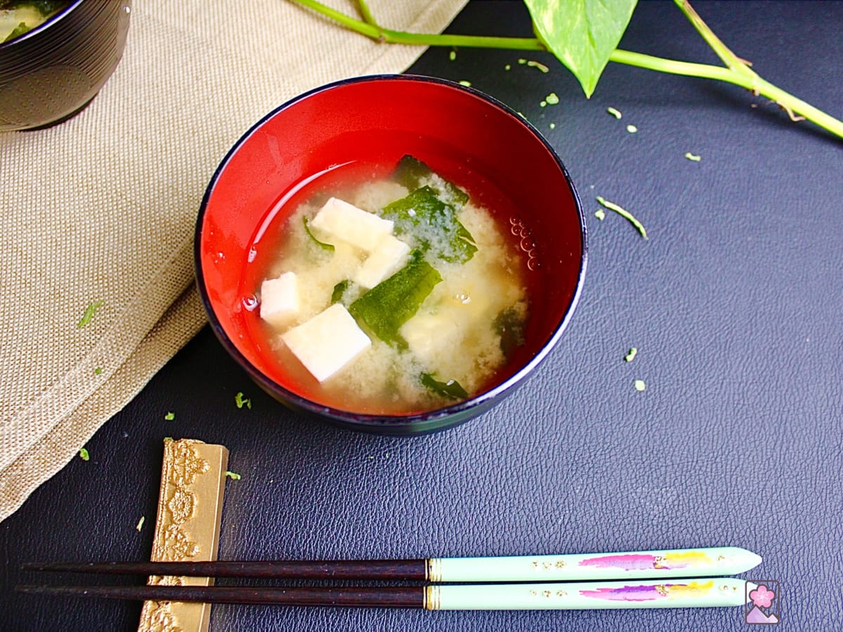 Miso soup ready to eat in a Japanese bowl with chopsticks