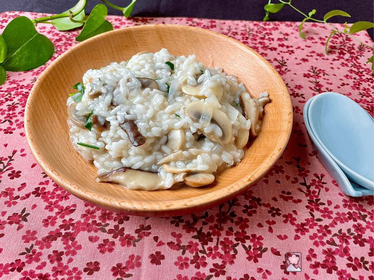 Creamy Mushroom Risotto Served in a wooden bowl on a placemat
