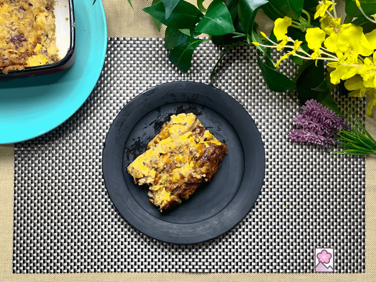 A slice of Leftover Turkey and Stuffing load on a ceramic plate.