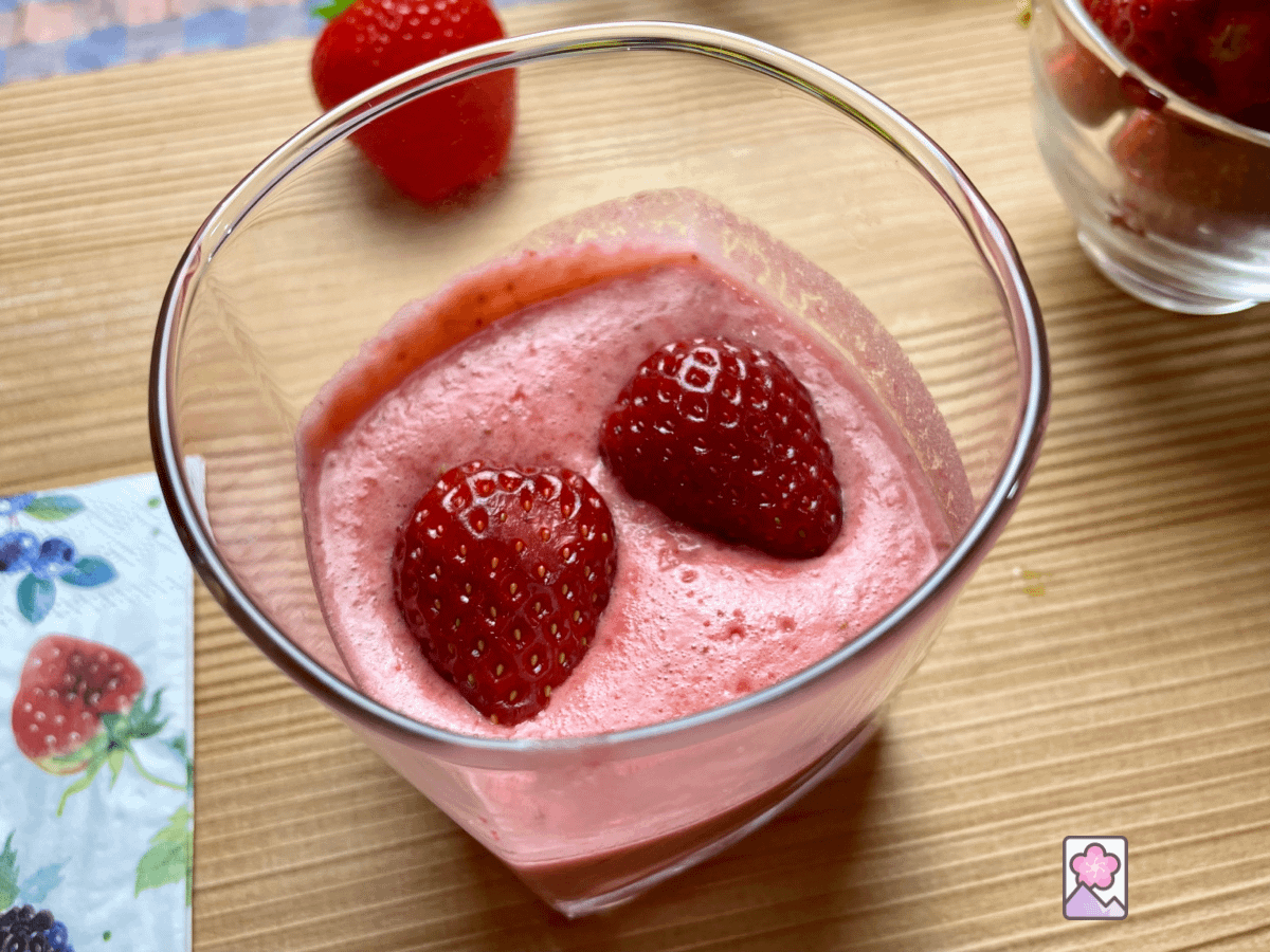Heavenly Strawberry Mousse in a glass is airy and light. It’s topped with a fresh strawberry cut in two.