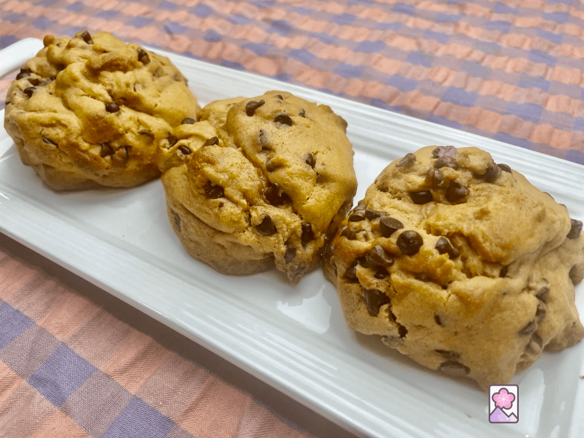 Three Bakery Style Chocolate Cookies lined up on a tray
