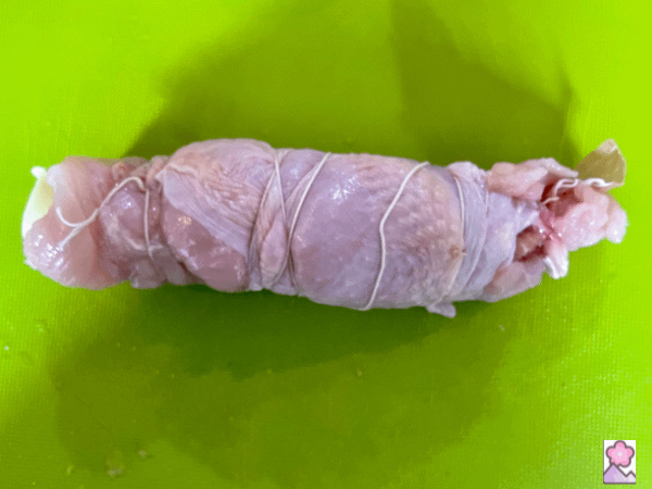Rolled up chicken tied with twine