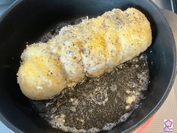 Frying a chicken rollup in a pan