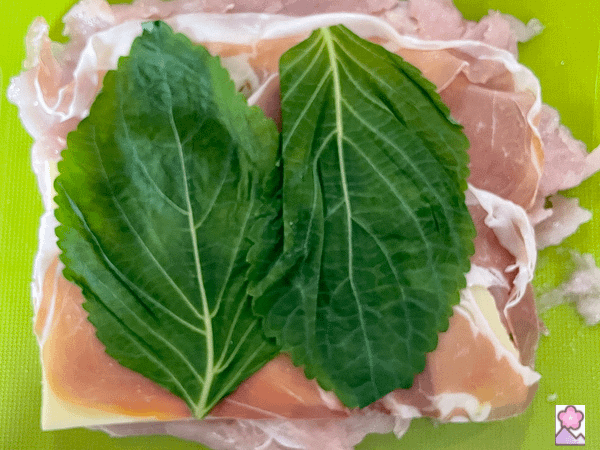 Chicken with cheese, ham, and shiso layered on top