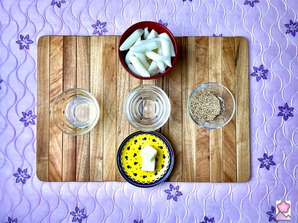 Honey Sesame Ricecake ingredients laid out on a wooden placemat