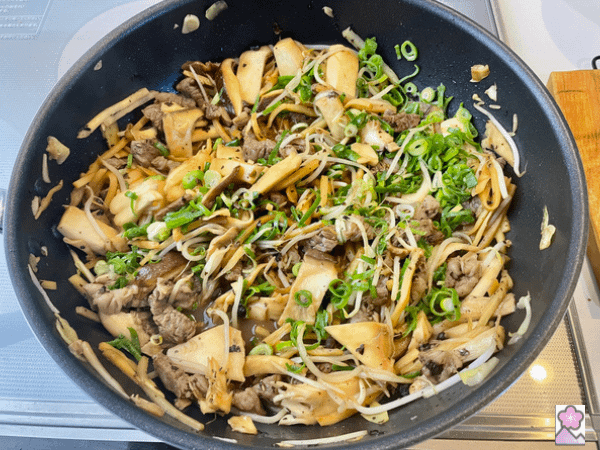 Beef and Bamboo in Black Bean sauce- now topped with scallions and sitting in the wok