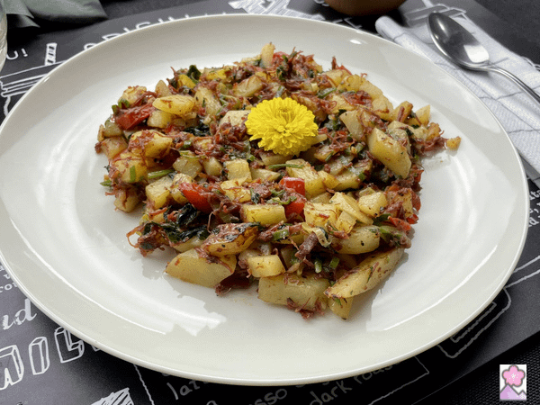 Savory Corned beef hash On a plate with a flower on top
