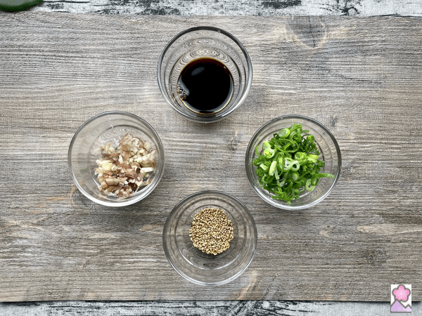 Sauce ingredients in cups on a board