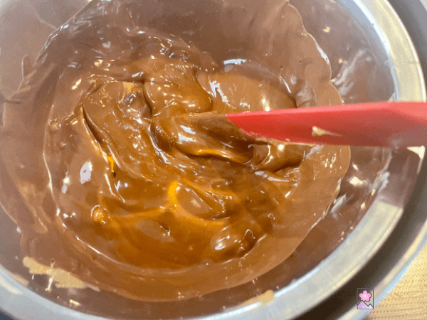 Melting chocolate and peanut butter together in a double boiler