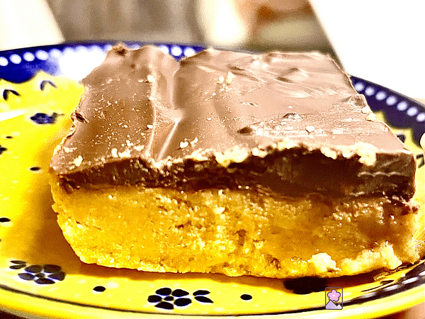 Close up of a No Bake Peanut Butter Bar on a plate.