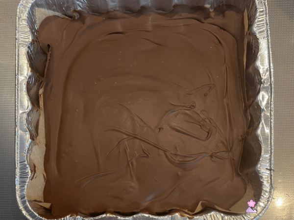 No bake peanut butter bars in the foil pan after the chocolate has hardened.