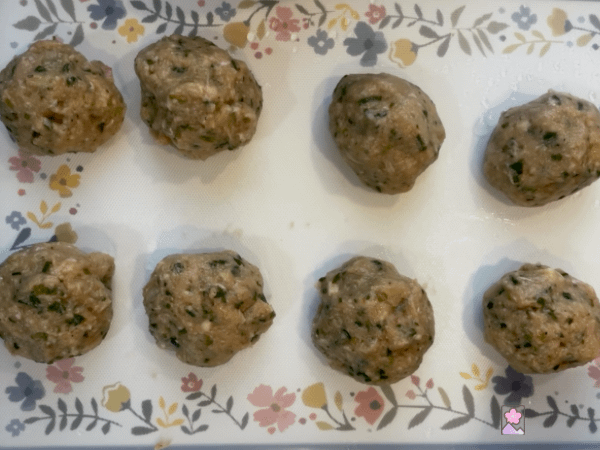 Formed meatballs On a decorative cutting board