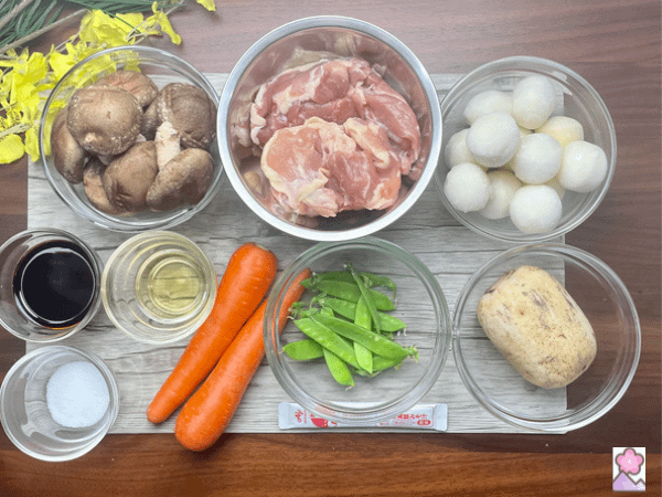 Chicken and Root Vegetable Nimono ingredients Laid out on a wooden placemat