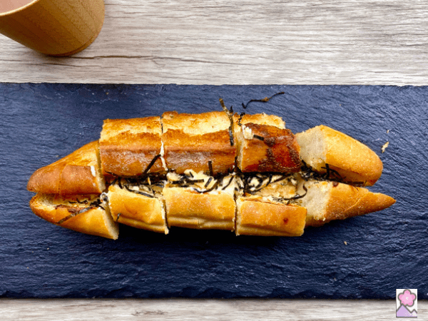 Sliced Mentaiko potato baguette On a slate tray