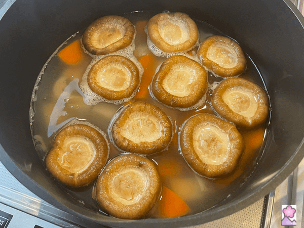Carrot mushroom and renkon after simmering for 30 minutes still in the pot