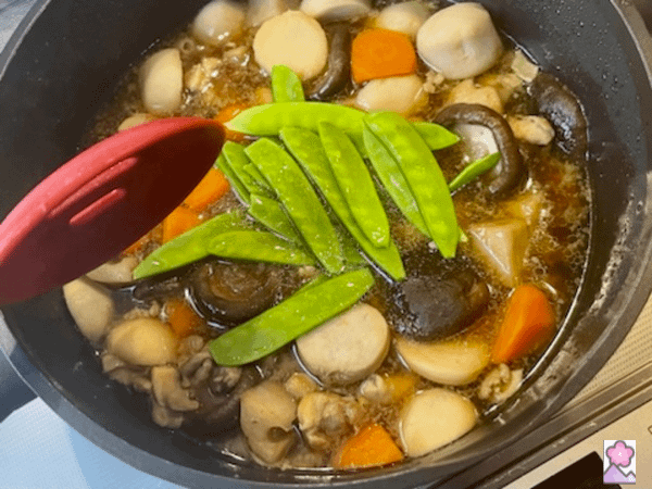 Nimono with snow peas just added before stirring