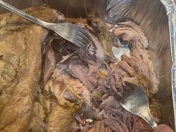 Shredding the pork with two forks