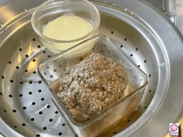 Steamed burger and cheese cooked and ready to remove