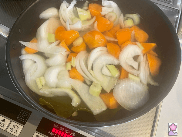 Stock with vegetables in a large pot