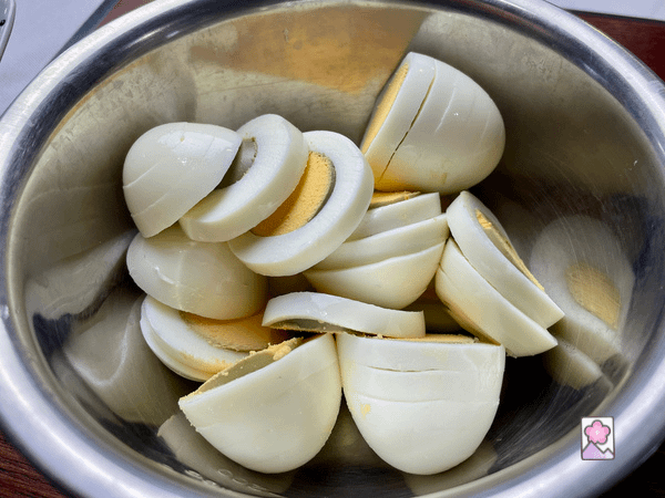Eggs thinly sliced in a bowl