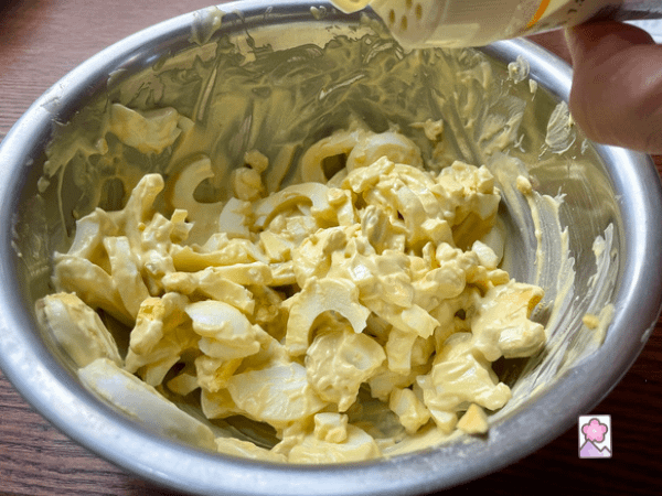 Prepared egg salad in a mixing bowl