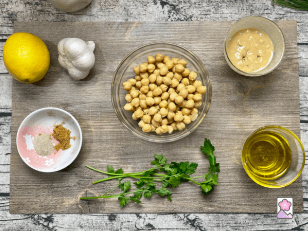 Mediterranean Hummus ingredients on a wood board