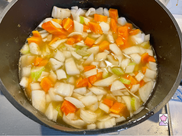 First boil the veggies, consommé and peas in a large stock pot