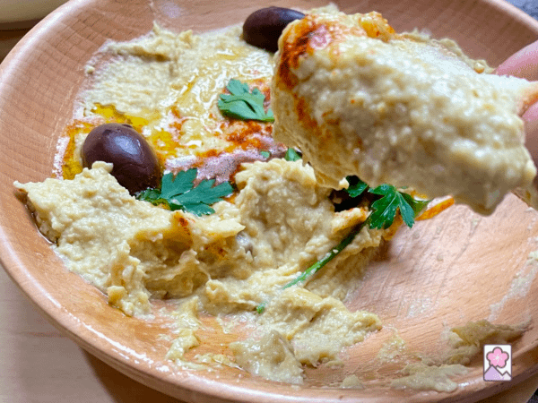 Hummus slathered on to a baguette