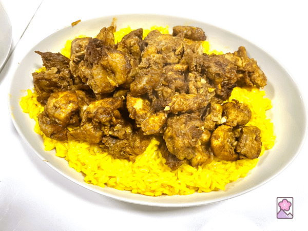 Chicken Shawama on a bed of saffron rice all served on a white platter