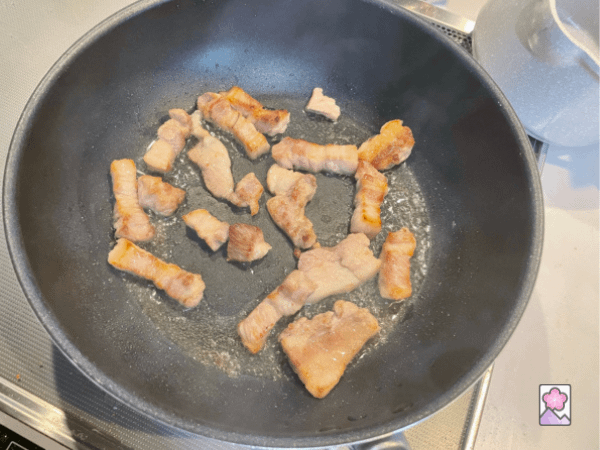 Browned pork belly fries in a frypan