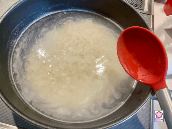 Hominy boiling in a large saucepan