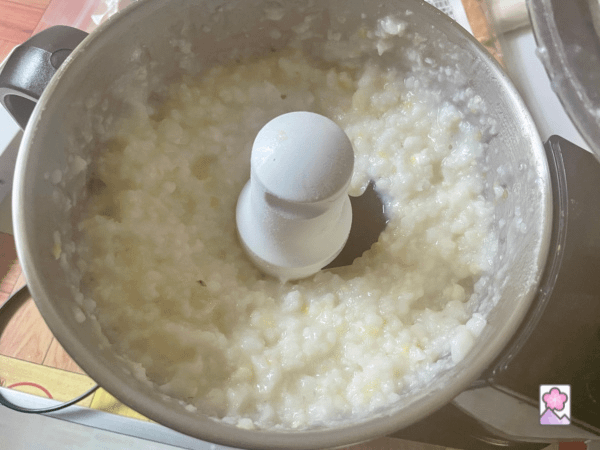 Hominy in a food processor copped into fine grains