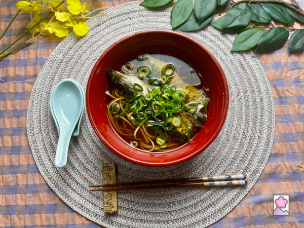 Nishin Soba in a bowl on a round placemat