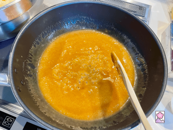 Yummy melted caramel sauce in a large saucepan