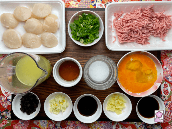 Ingredients on a board for savory Scallops with Lobster Sauce