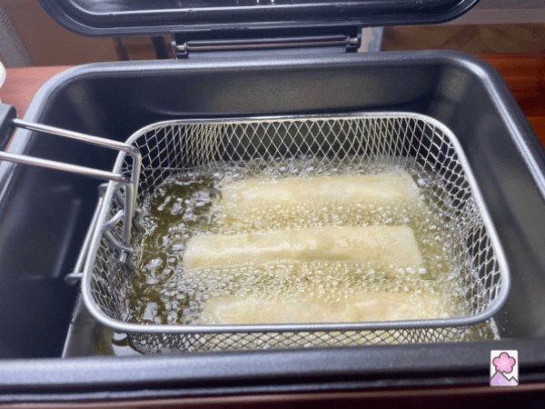 3 harumaki in a deep fryer