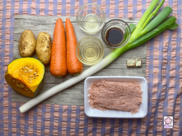 Kabocha Stew Ingredients laid out on a wood board