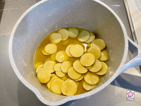 Cocoa butter melting over medium heat in a saucepan