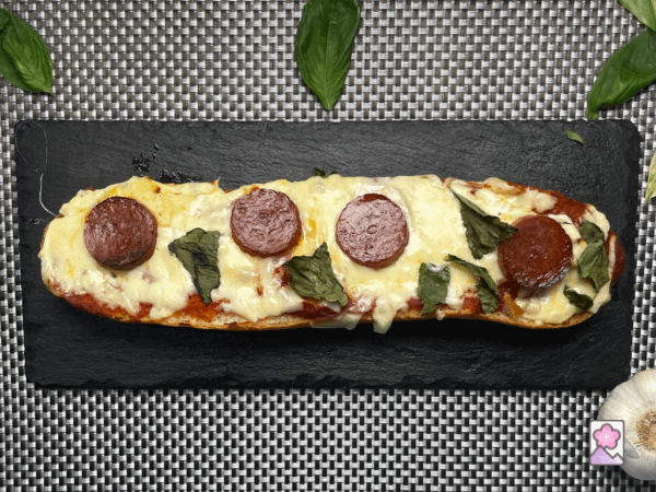 A large slice of pizza bread