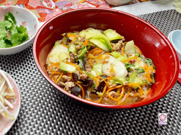 Beefun with cilantro and bean sprouts in small serving bowls on the side
