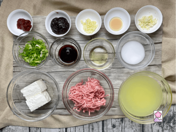 Tofu in XO Sauce ingredients lined up on a wooden board