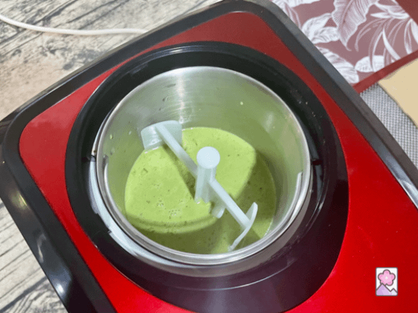 Matcha ice cream in the ice cream maker. Ready for churning.