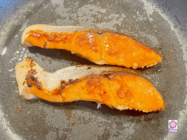 Koji salmon searing in a skillet