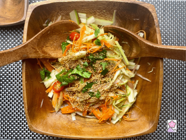 A big wood serving bowl loaded with Japanese Celery salad