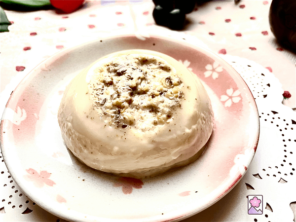 Chestnut Panna Cotta with chestnut chunks on top on a plate