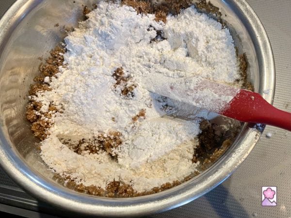 Mixing white flour into the dough