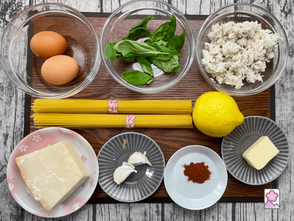 Lemony Crabmeat Spaghetti ingredients on a wooden board