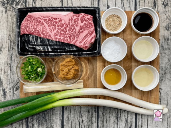 Ingredient board for iso Marbled Beef Skewers features tender Wagyu, leeks, and a variety of other ingredients