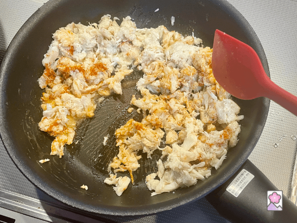 Saute the crab in a skillet with butter and paprika