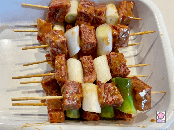Beef and leek threaded on skewers